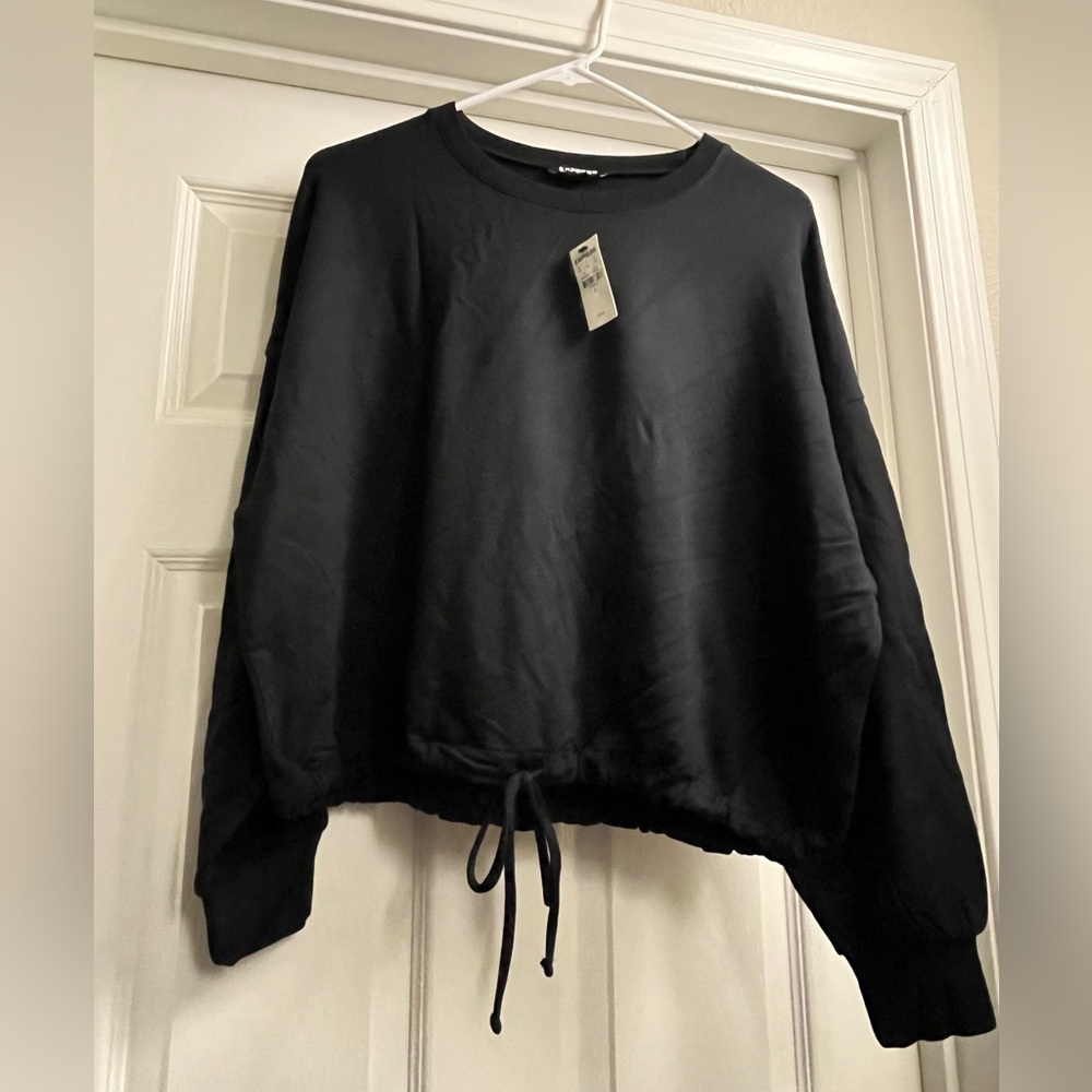 Long sleeve banded bottom sweatshirt. NWT.